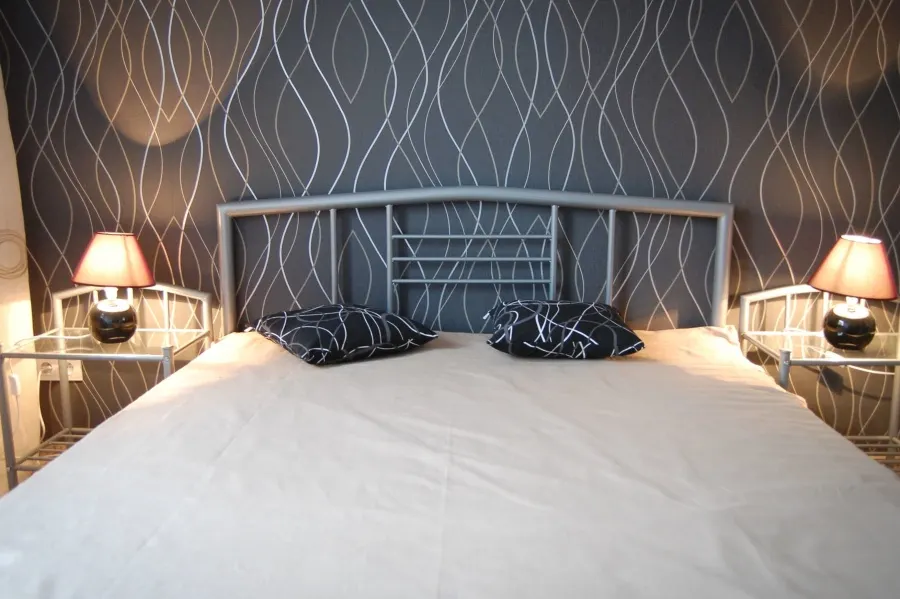 Photo with bed, pillow and lamp
