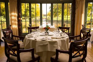 Photo with chair, kitchen & dining room table and curtain