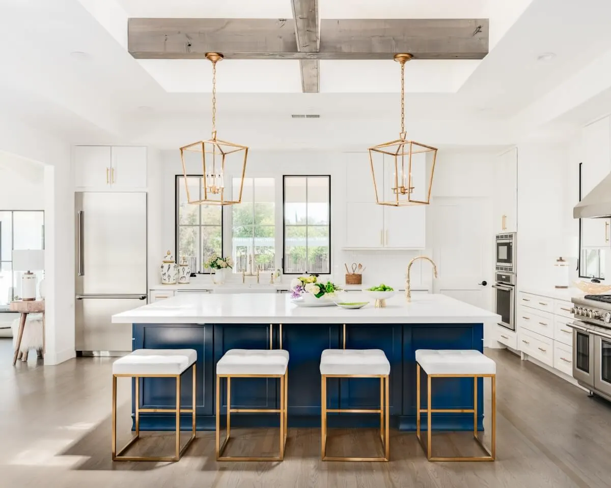 Photo with stool, cabinetry, oven and refrigerator