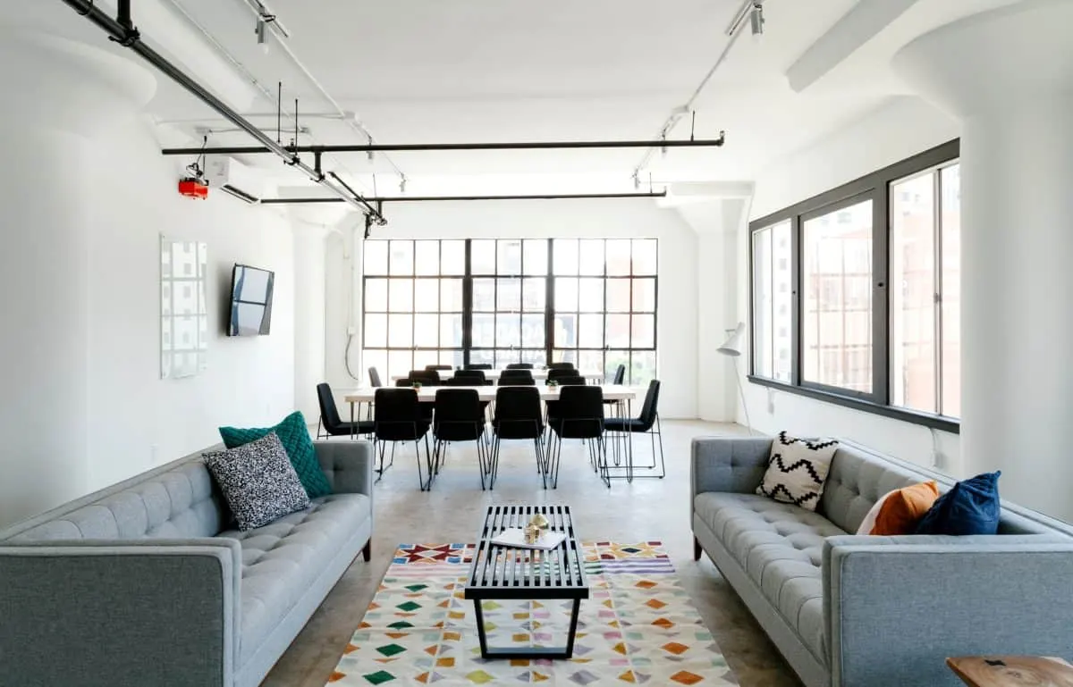 Photo with coffee table, studio couch, table, pillow, window and carpet