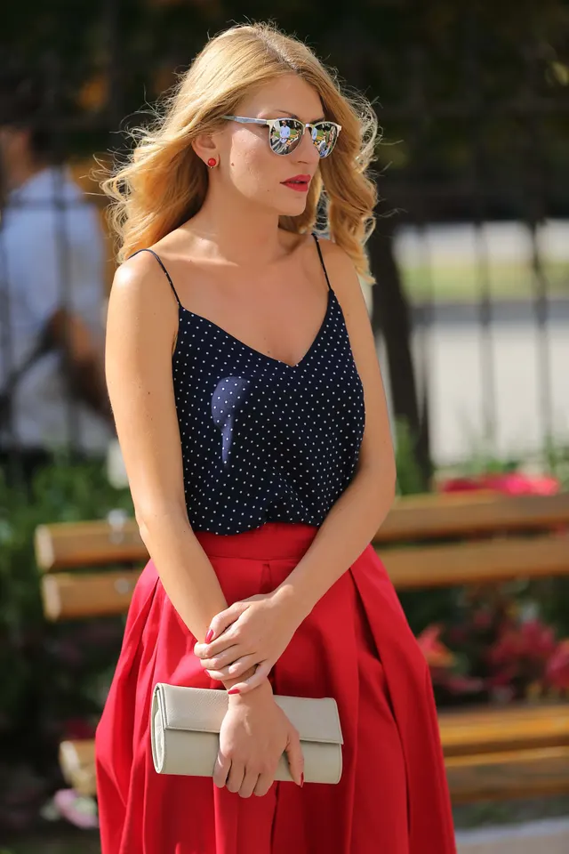 Photo with fancy dress, glasses, handbag and bench