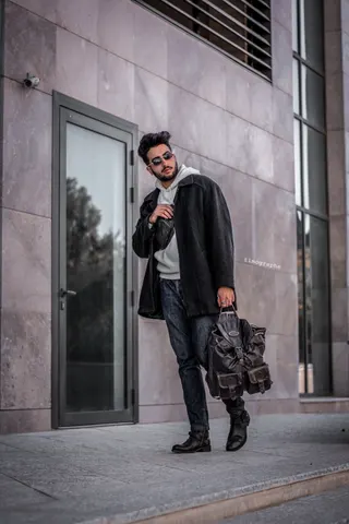 Photo with trousers, jacket, handbag, leather shoes and door