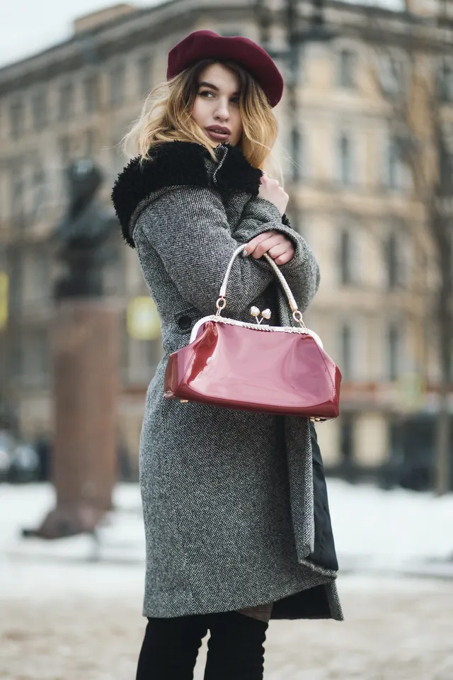 Photo with black leggings, coat, hat and handbag
