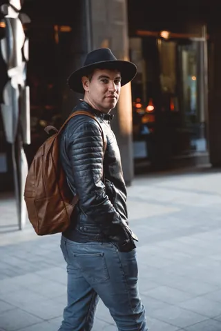Photo with jacket, trousers, backpack and hat