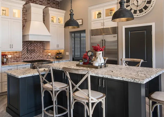 Photo with chair, cabinetry, kitchen appliance, lamp, refrigerator and countertop