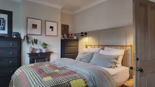 Video with picture frame, cabinet, bed and pillow