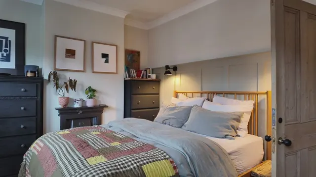 Video with picture frame, cabinet, bed and pillow