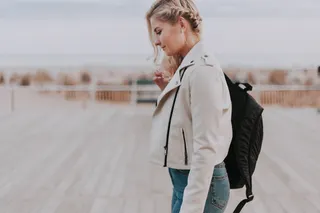 Photo with trousers, jacket and backpack