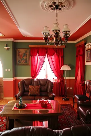 Photo with studio couch, chair, picture frame, curtain, carpet and lamp