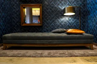 Photo with bed, lamp, mirror, pillow and carpet