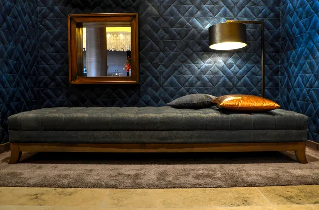 Photo with bed, lamp, mirror, pillow and carpet