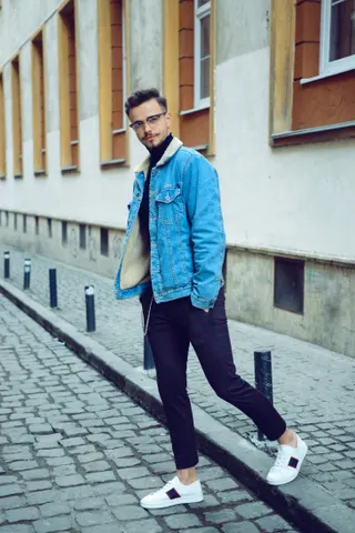 Photo with jacket, trousers, sneakers, glasses and window