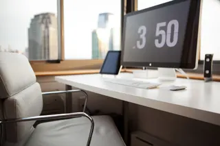 Photo with chair, desk, computer keyboard and television