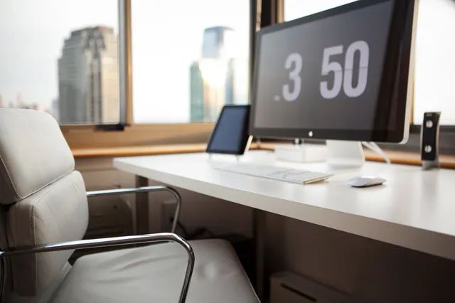 Photo with chair, desk, computer keyboard and television