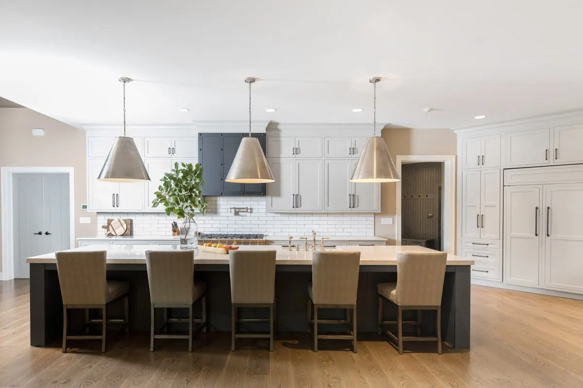 Photo with desk, cabinetry, houseplant and lamp