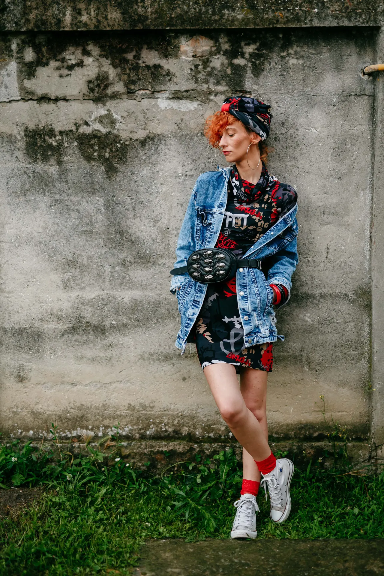 Photo with jacket, sneakers and black purse