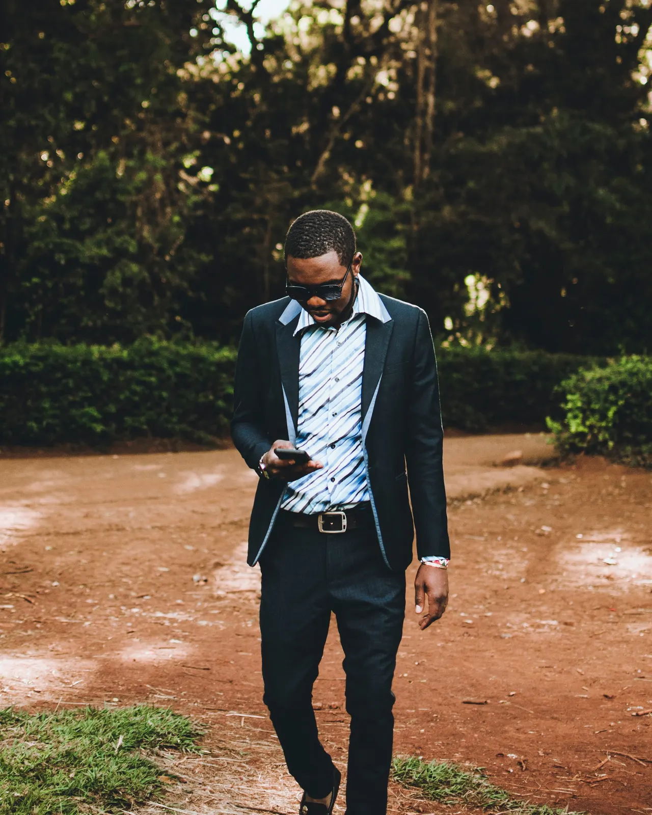 Photo with trousers, shirt, belt, shoes and glasses