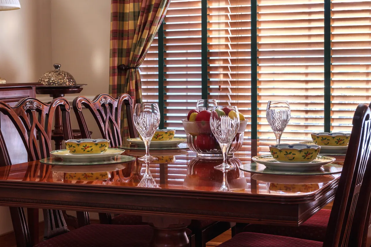 Photo with chair, desk, curtain, plate and wine glass