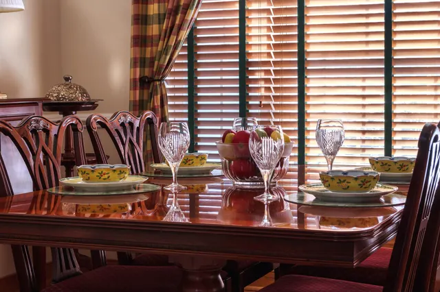 Photo with chair, desk, curtain, plate and wine glass