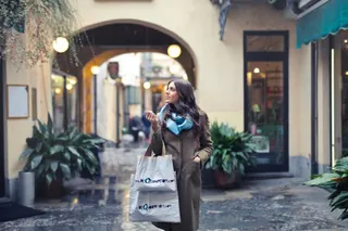 Photo with coat, handbag, scarf and houseplant