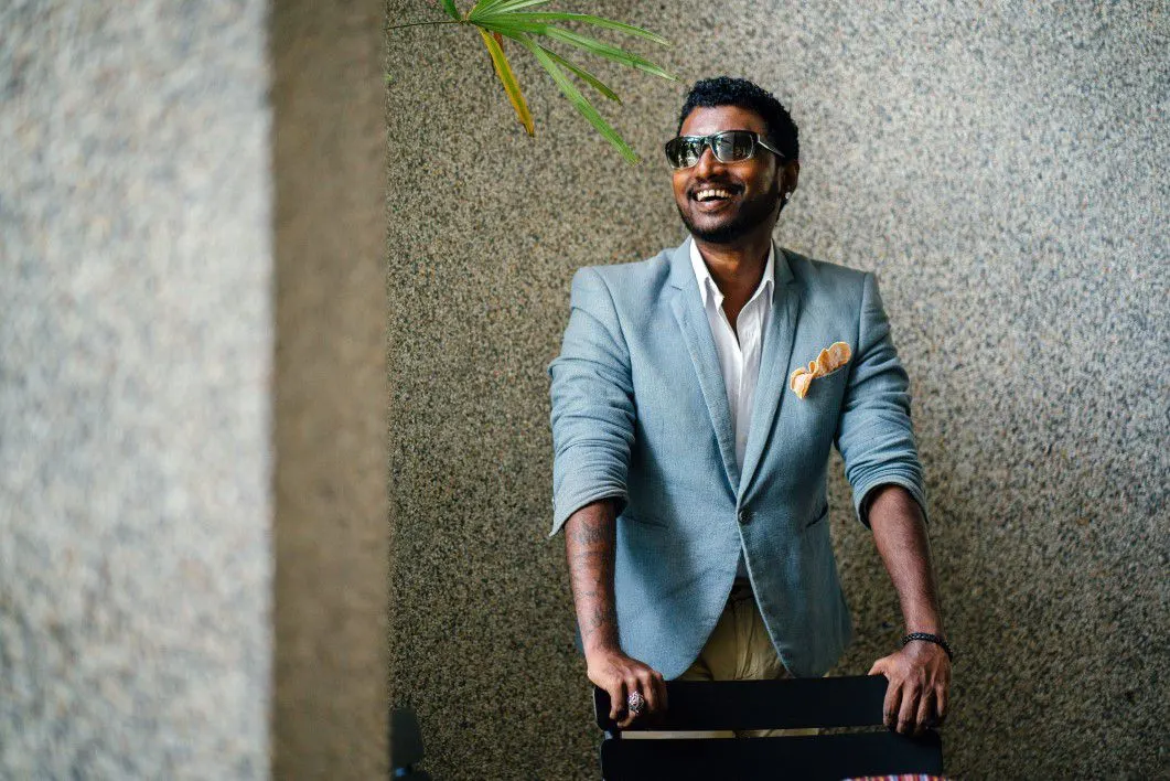 Photo with jacket, pants, glasses and chair