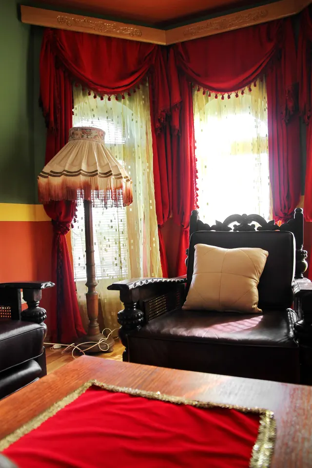 Photo with desk, chair and curtain