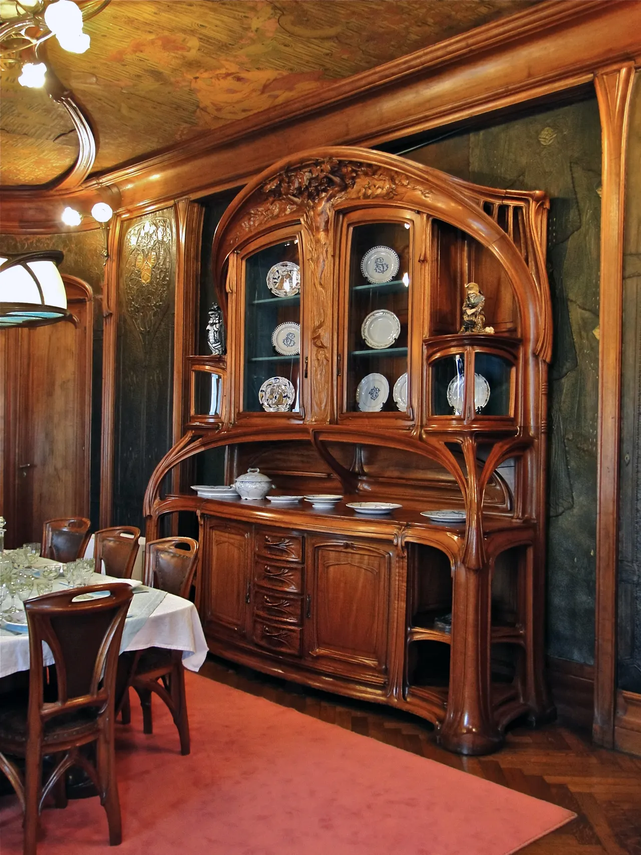 Photo with desk, cabinetry, lamp and carpet
