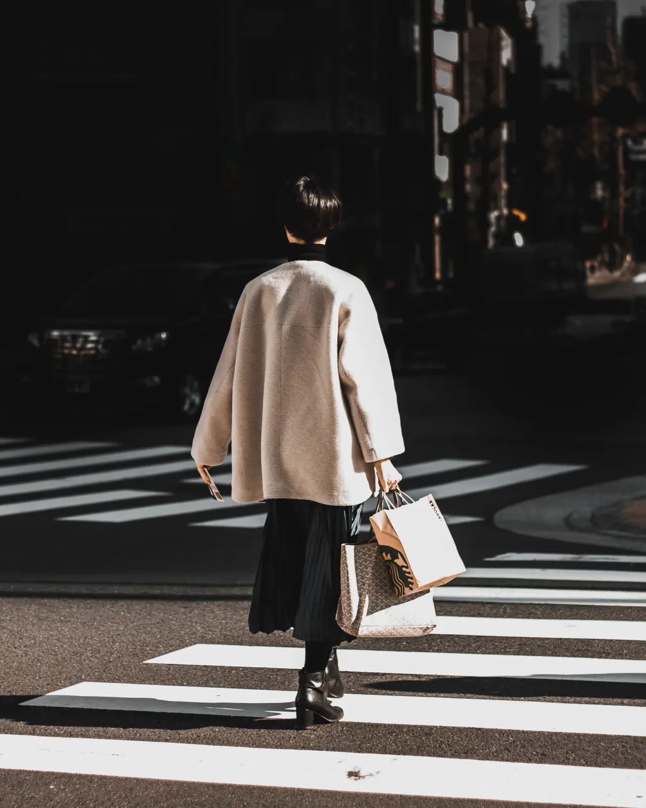 Photo with miniskirt, coat, high heels, handbag and glasses