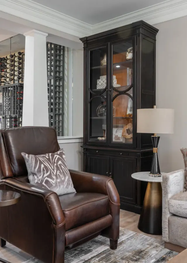 Photo with studio couch, cabinetry, desk, chair, carpet, lamp and pillow